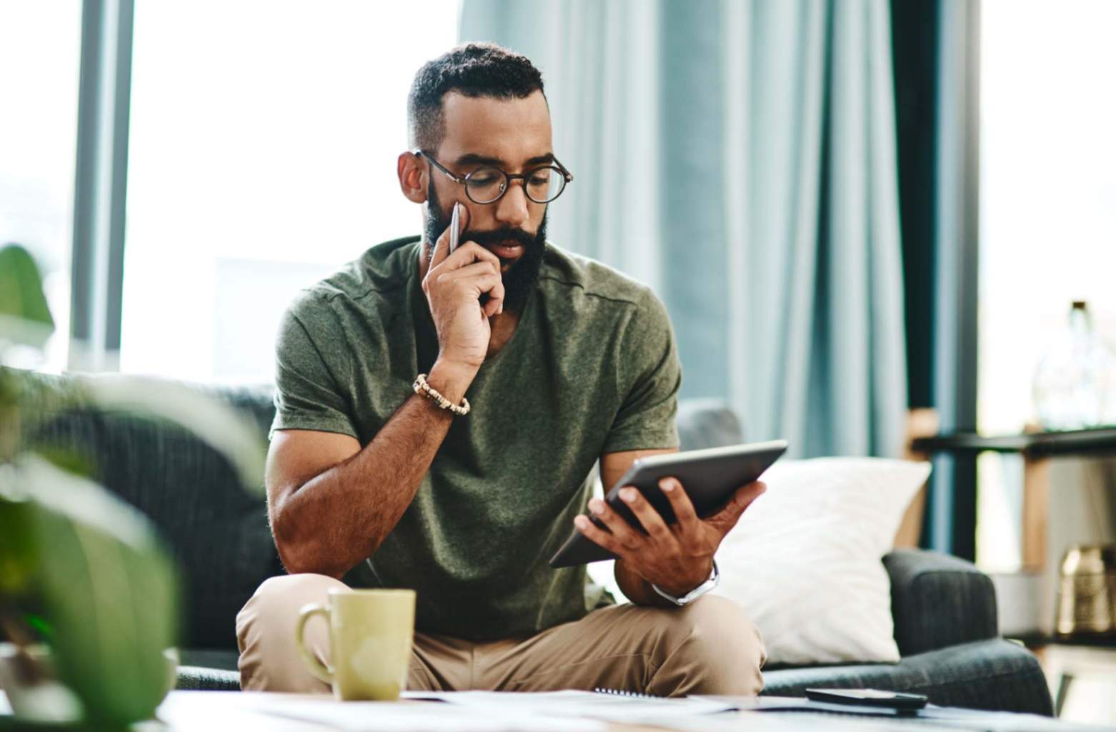 A person looking at their finances on a tablet